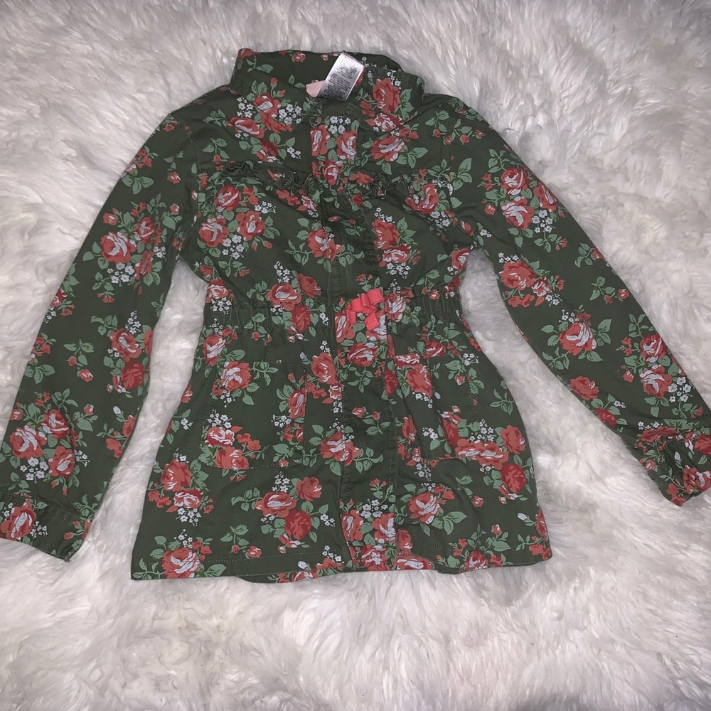 Green jacket with a nice pink floral pattern